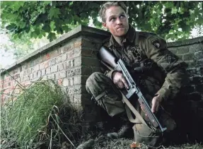  ?? PHOTOS BY PETER MOUNTAIN ?? Wyatt Russell, son of Kurt Russell and Goldie Hawn, stars as explosives expert Ford in the World War II zombie pic, “Overlord.”