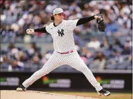  ?? Seth Wenig / Associated Press ?? Yankees starting pitcher Gerrit Cole throws during the first game of a doublehead­er against the Rangers on Sunday.