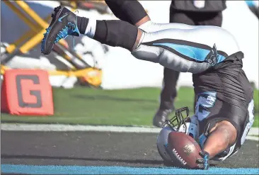  ?? Mike McCarn / AP ?? Carolina’s Jonathan Stewart (28) falls into the end zone Sunday for a touchdown against the Minnesota Vikings.