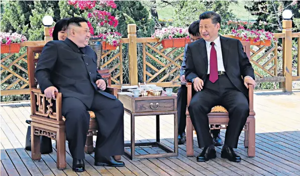  ??  ?? Kim Jong-un, the North Korean leader, with Xi Jinping, the Chinese president, in Dalian in north-eastern China’s Liaoning province ahead of the expected Kim-trump talks