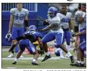  ?? TIM PHILLIS — FOR THE NEWS-HERALD ?? Willoughby South grad Devanaire Conliffe stiff arms a teammate during Notre Dame College’s intrasquad scrimmage Aug. 19.