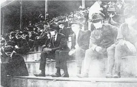  ?? AP PHOTO ?? Georgia Tech football fans take in a game at Grant Field during the 1918 season .