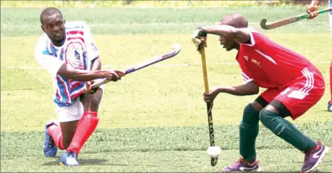  ?? Photo: Henry Onini ?? Team Delta hockey player ( left) being challenged by his counterpar­t from Akwa Ibom in one of the matches played at the on- going Edo 2020 National Sports Festival in Benin City.