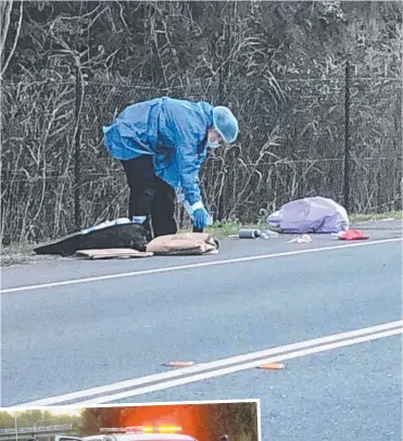  ??  ?? Police at the scene in Helensvale where a man was found lying on the side of the road with gunshot wounds yesterday.