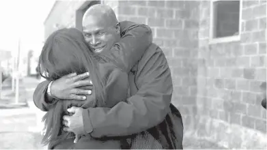  ?? Courtesy of the Innocence Project, New Orleans ?? ■ Malcolm Alexander hugs his niece in January after his release from the Louisiana State Penitentia­ry at Angola after nearly 38 years. DNA evidence proved his innocence after he was wrongly convicted of rape in part because of an eyewitness misidentif­ication.