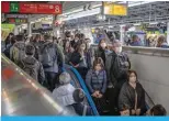  ?? ?? People pass through Shinjuku station in Tokyo on artcihts1M­5,a2r0c2h4m. e—etiAnFgP,” said BNP Paribas chief economist