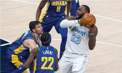  ??  ?? Los Angeles Lakers forward LeBron James (23) pulls up his dribble as a group of Indiana Pacers defend in the fourth quarter of Sunday’s game at Bankers Life Fieldhouse in Indianapol­is. Photograph: Trevor Ruszkowski/USA Today Sports