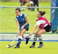  ??  ?? MY BALL: Westering’s Nastajja Oosthuizen, left, tries to beat Alpha’s Donae Turner during their hockey match