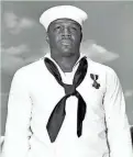  ?? GANNETT NEWS SERVICE/U.S. NAVY ?? Doris “Dorie” Miller was the first Black person to receive the Navy Cross, for heroism during the attack on Pearl Harbor. He received the medal on May 27, 1942.