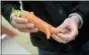  ?? JOSHUA MCKERROW — THE BALTIMORE SUN VIA AP ?? This shows a carrot at Imperfect Produce in Severn, Md. The company delivers fruit and vegetables that have been rejected by grocery stores for not fitting cosmetic standards.