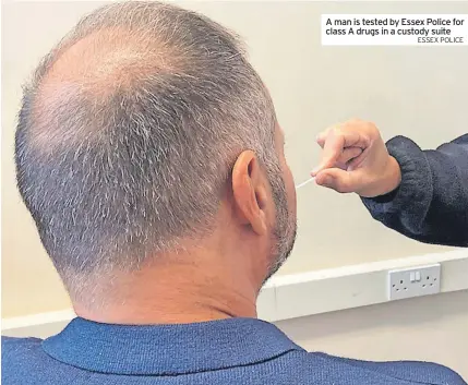  ?? ESSEX POLICE ?? A man is tested by Essex Police for class A drugs in a custody suite