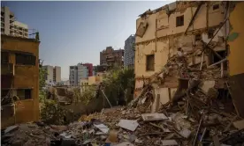  ??  ?? Damaged buildings near the site of last week’s explosion in Beirut. Photograph: Hassan Ammar/AP