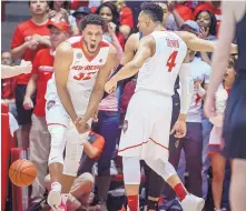  ?? ROBERTO E. ROSALES/JOURNAL ?? UNM’s Tim Williams, left, and Elijah Brown celebrate after Williams scored against San Diego State Saturday. Coach Craig Neal says Williams’ presence does a lot for the Lobos.