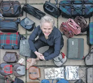  ?? Picture: Stewart Attwood ?? BRAND NEW: Diane Ness with her travel bags and handbags, which she designed at her home.