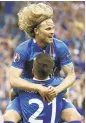  ?? ODD ANDERSEN/AFP/GETTY IMAGES ?? Arnor Ingvi Traustason celebrates an Iceland goal with Birkir Bjarnason.