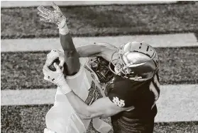  ?? Maddie Meyer / Getty Images ?? Notre Dame’s Ben Skowronek catches a touchdown pass as Boston College’s Brandon Sebastian defends. The Fighting Irish gained 561 yards of offense.