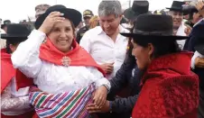  ?? — AFP photo ?? Boluarte interacts with the public during the laying of the foundation stone for the asphalting of a road in the Chiara district in the Ayacucho region, some 570 km southeast of Lima.