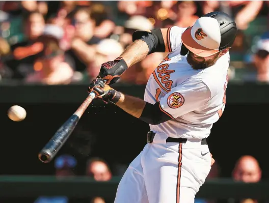  ?? SCOTT TAETSCH/GETTY ?? Orioles outfielder Colton Cowser connects on a solo homer against the Milwaukee Brewers on Sunday in Baltimore. It was his fourth homer in his past four games.