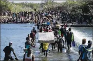  ?? THE NEW YORK TIMES ?? A record 1.7 million migrants, many of them fleeing pandemic-ravaged countries, were encountere­d trying to enter the U.S. illegally in the last year.