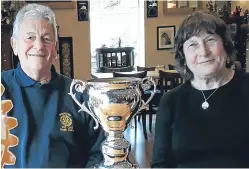  ??  ?? Rotarian Dougal Spaven with Lesley Whitwood and the Rotary Citizen of the Year trophy.