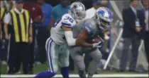  ?? RON JENKINS —THE ASSOCIATED PRESS FILE ?? Dallas Cowboys defensive back Jeff Heath tackles then-Detroit Lions wide receiver Golden Tate during a Sept. 30 game between the teams in Arlington, Texas.