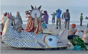  ?? — PTI ?? A devotee offers prayers at Sagar Island in West Bengal on Thursday morning ahead of the Gangasagar Mela to be held in the second week of January.