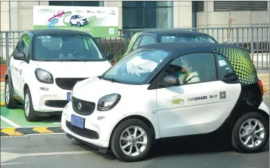  ?? TAN XI / FOR CHINA DAILY ?? A woman drives a vehicle of Car2Share service in Chengdu, capital of Sichuan province.