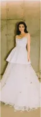  ?? ANDREW KWON ?? A wedding dress with mixed fabrics.