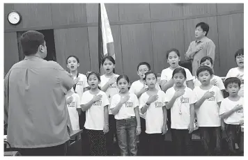  ?? CONTRIBUTE­D PHOTO ?? The Children's Paradise Montessori Choir, a newly-formed but award-winning choir in Barangay Canduman, Mandaue City, performs at the City Council's session on Wednesday.