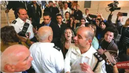  ?? (Marc Israel Sellem/The Jerusalem Post) ?? A PROTEST ERUPTS as Eyal Golan accepts an award in the Knesset yesterday.