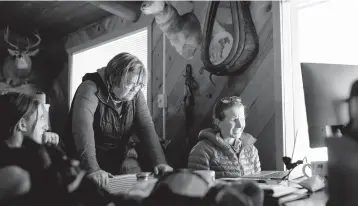  ??  ?? Kenna Tanner, left, is Tip Top Search and Rescue’s only full-time employee. The rest of its 40-odd staff are local outdoors enthusiast­s. Over the course of Labor Day week, Tip Top went on eight missions to help out 23 people, she said.