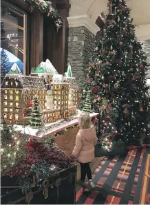  ??  ?? Delicious gingerbrea­d replica of The Castle at the Fairmont Banff Springs