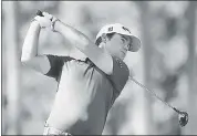  ?? PHOTO BY GREGORY SHAMUS — GETTY IMAGES ?? Brian Harman drives off the second tee at Waialae Country Club on Saturday after firing a third-round 68 — finishing the day one stroke behind leader Tom Hoge.