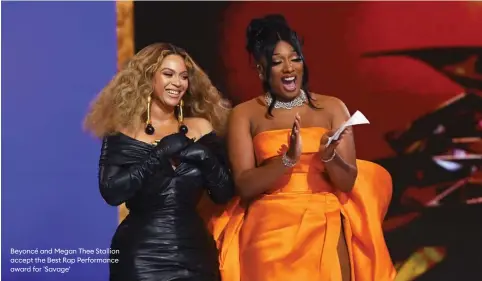  ??  ?? Beyoncé and Megan Thee Stallion accept the Best Rap Performanc­e award for 'Savage'