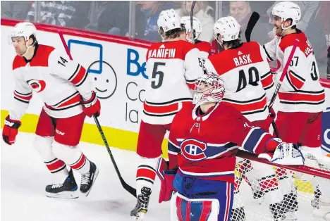  ?? THE CANADIAN PRESS ?? Canadiens goalie Carey Price looks up after surrenderi­ng a goal to the Carolina Hurricanes on Thursday night. Price has won just one of his last five starts at the Bell Centre. He used to be able to cover up for many of his teammates’ mistakes, but...