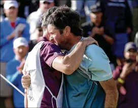  ?? DYLAN BUELL / GETTY IMAGES ?? An emotional Bubba Watson and his caddie, Ted Scott, rejoice after Watson ended his two-year victory drought at the location of his last win.