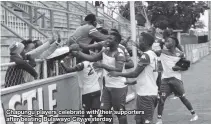  ??  ?? Chapungu players celebrate with their supporters after beating Bulawayo City yesterday