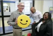  ?? STEVE APPS/WISCONSIN STATE JOURNAL VIA AP ?? Wisconsin Governor-elect Tony Evers, left, and Lt. Governor-elect Mandela Barnes, right, with pillows found on the tour of the Boys &amp; Girls Club of Dane County. State Rep-elect Shelia Stubbs (D-Madison) is right. On Wednesday Nov. 7. Governor-elect Tony Evers, and Lt. Governor elect Mandela Barnes took a tour of the Boys &amp; Girls Club of Dane County in Madison, Wis.