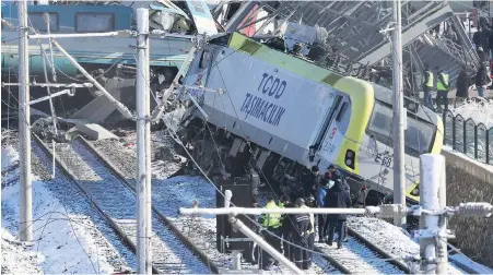  ?? BURHAN OZBILICI, THE ASSOCIATED PRESS ?? Rescue crews work at the scene of a high-speed train crash in Ankara, Turkey, on Thursday.