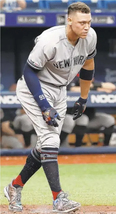  ?? AP ?? Aaron Judge heads to the dugout after striking out against the Rays during the fifth inning on Sunday.