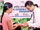  ??  ?? Women entreprene­ur receives a loan from Asela Ratnayaka, Vice President and Head of Institutio­nal Financing Group, Citi Sri Lanka. Shanaka Waduge, Manager, Corporate Affairs, Citi Sri Lanka looks on