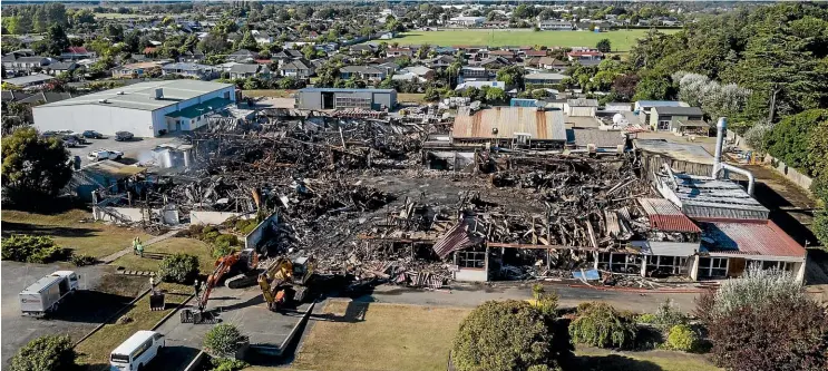  ?? CREDIT: STACY SQUIRES/STUFF ?? Firefighte­rs battled to bring the blaze under control, and remained at the site on Sunday to ensure the fire was out.