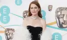  ?? Photograph: Ian West/PA ?? Julianne Moore wore a Saint Laurent column black dress with a fluffy white marabou coat.