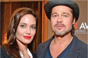  ??  ?? Estranged: Ms Jolie and Pitt the year before their marriage ended