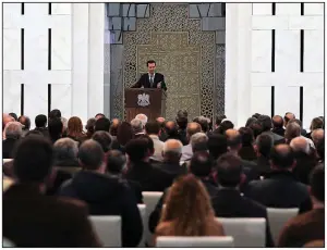  ?? AP/ SANA ?? Syrian President Bashar Assad speaks Sunday at a meeting in Damascus with leaders of local councils from each of the country’s provinces.