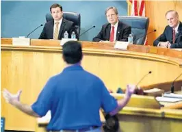  ?? JOE BURBANK/STAFF PHOTOGRAPH­ER ?? Florida legislator­s, from left, Rep. Jason Brodeur, Rep. Scott Plankon and Sen. David Simmons listen as Chris Flack, Duke’s vice president of government affairs, apologizes for missteps in Duke’s response to Hurricane Irma.