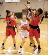  ?? Photo courtesy of JBU Sports Informatio­n ?? John Brown junior Kimmy Deines weaves her way through Bacone defenders during the first half of Thursday’s game at Bill George Arena. The Golden Eagles defeated Bacone 79-52. JBU returned to action at Mid-America Christian on Saturday. Results were not...