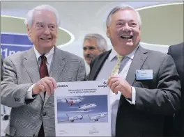  ?? PHOTO: AP ?? Bill Franke, of Indigo Partners, left, and John Leahy, of Airbus, hold an MOU after an Airbus announceme­nt of selling 430 airplanes to US firm Indigo Partners for $49.5 billion yesterday.