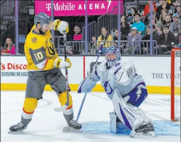  ?? L.E. Baskow Las Vegas Review-journal @Left_eye_images ?? Center Nicolas Roy fails to deflect a puck past Lightning goaltender Andrei Vasilevski­y, one of several scoring chances the Knights failed to capitalize on.