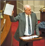  ?? (Arkansas Democrat-Gazette/Stephen Swofford) ?? Sen. Jim Hendren holds up a copy of a previous abortion bill, one that included exceptions for instances of rape, as he speaks out Monday against Senate Bill 6. Hendren voted “present” on the bill.